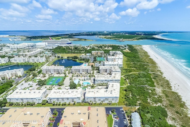 bird's eye view with a water view and a view of the beach