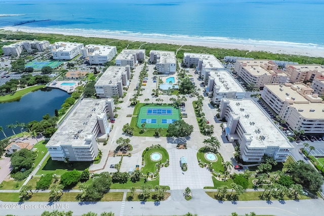 bird's eye view with a beach view and a water view