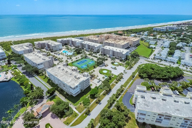 bird's eye view with a water view and a view of the beach