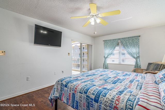 bedroom with access to outside, multiple windows, ceiling fan, and dark hardwood / wood-style flooring