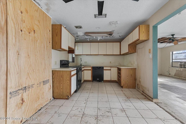 kitchen with black appliances, ceiling fan, and a textured ceiling