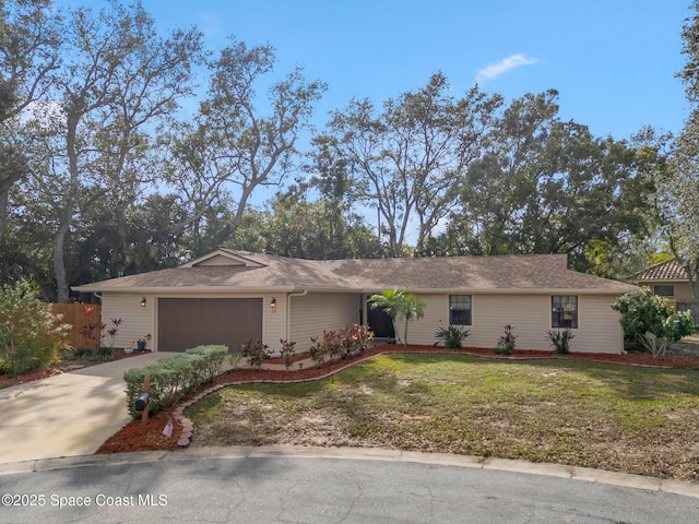 single story home featuring a garage and a front lawn