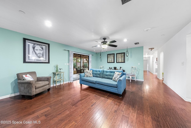 living room with hardwood / wood-style floors and ceiling fan