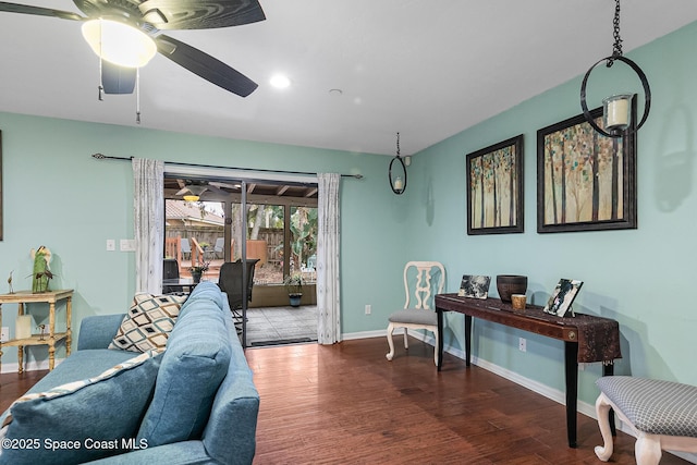 living room featuring ceiling fan and hardwood / wood-style floors