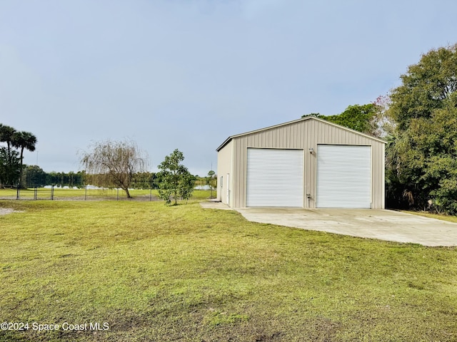 garage featuring a yard