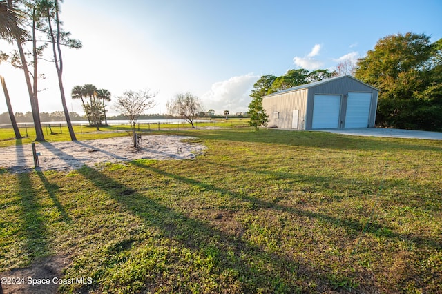 view of yard with an outbuilding and a garage