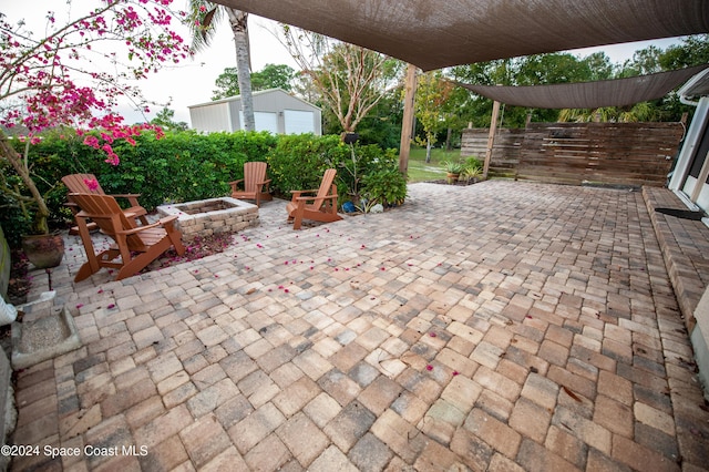 view of patio featuring an outdoor fire pit