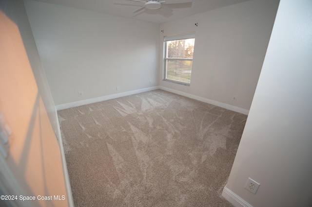 carpeted empty room with ceiling fan