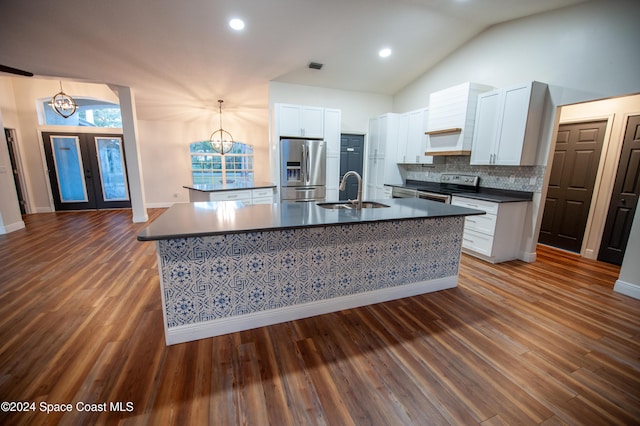 kitchen featuring stainless steel appliances, sink, white cabinets, an inviting chandelier, and french doors