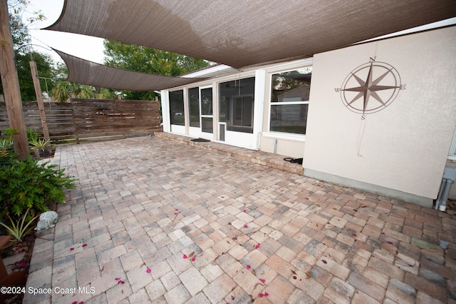 view of patio / terrace with a sunroom