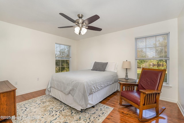 bedroom featuring ceiling fan and wood-type flooring