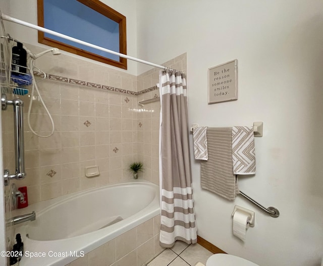 bathroom featuring toilet, shower / bath combo, and tile patterned floors