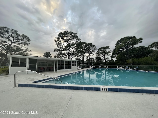 view of pool featuring a patio