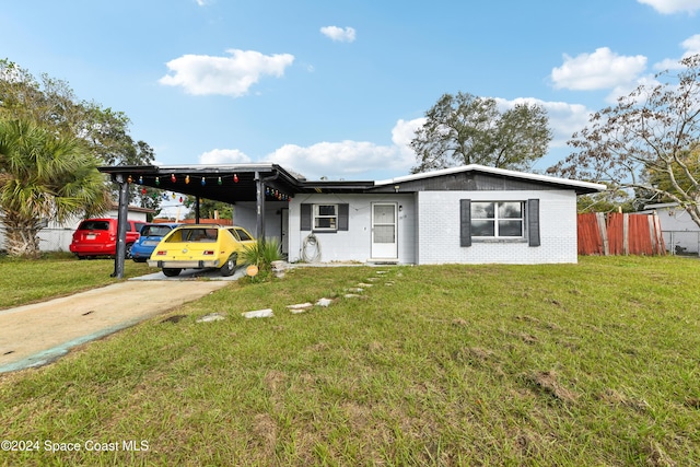 ranch-style house with a front lawn and a carport