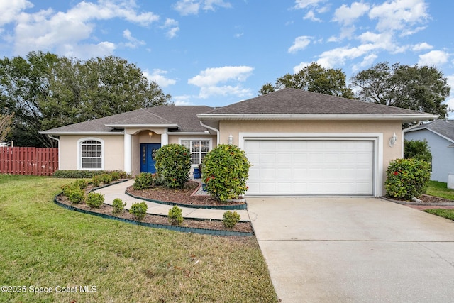 single story home with a garage and a front lawn