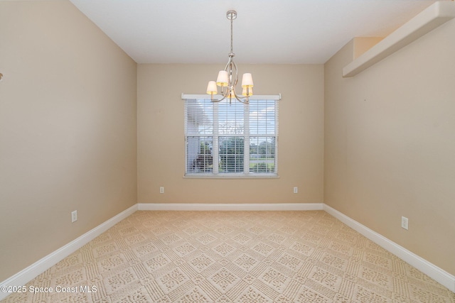 empty room with a chandelier