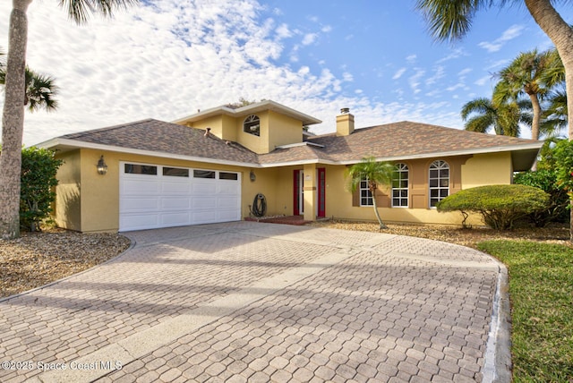 view of front of home with a garage