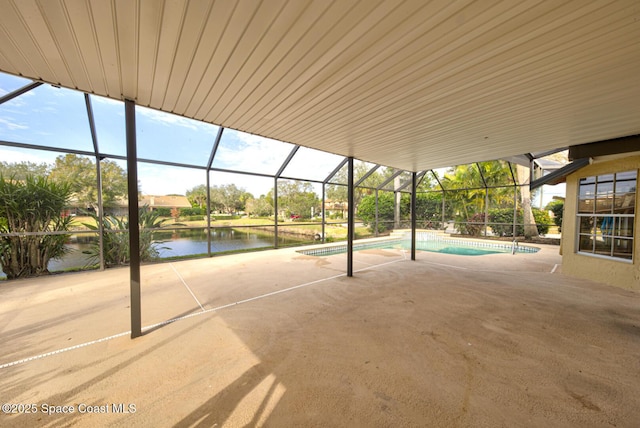 view of patio / terrace featuring a water view and a lanai