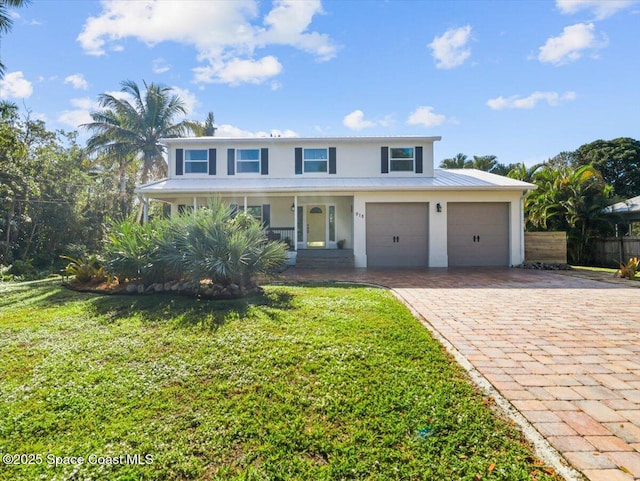 front of property featuring a porch and a front lawn