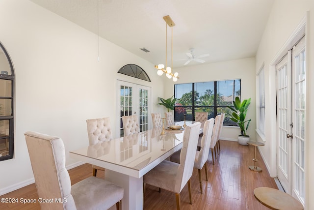 dining area with french doors, dark hardwood / wood-style flooring, and ceiling fan