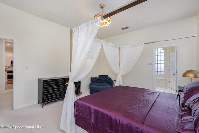 carpeted bedroom featuring ensuite bathroom