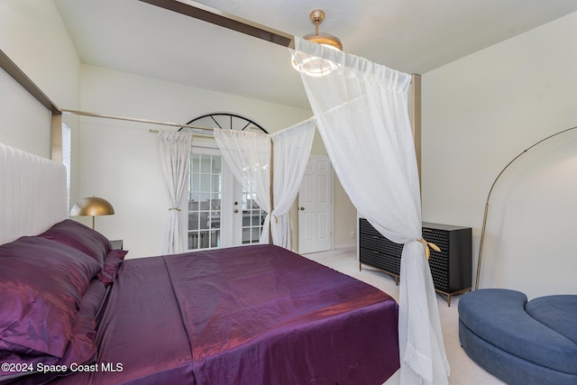 bedroom with light colored carpet