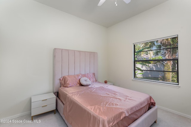 bedroom featuring light carpet and ceiling fan