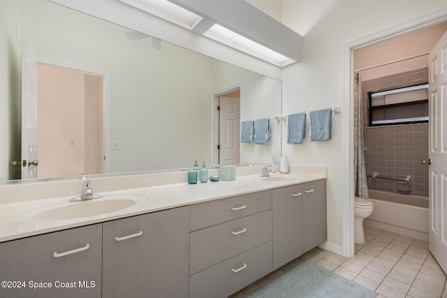 full bathroom featuring tile patterned floors, vanity, shower / bath combo, and toilet