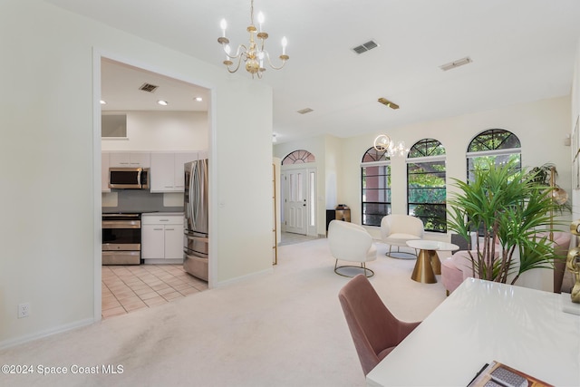 interior space featuring a notable chandelier and light colored carpet