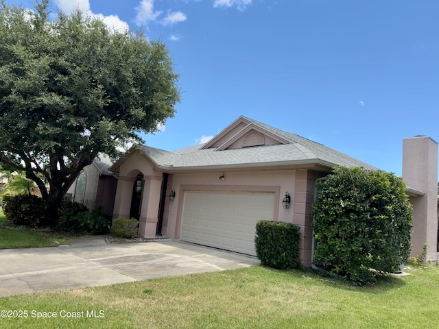 4740 Seminole Trl, Merritt Island, FL 32953 - single story home with concrete driveway, a garage, a front lawn, stucco siding, and roof with shingles