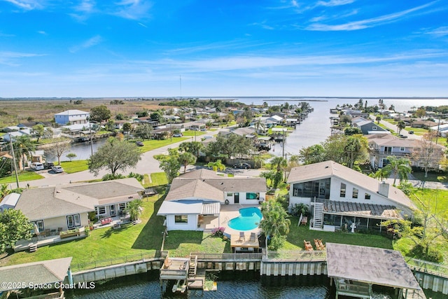 bird's eye view with a water view