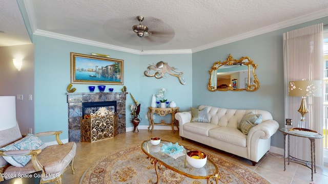 tiled living room featuring ceiling fan, a fireplace, crown molding, and a textured ceiling