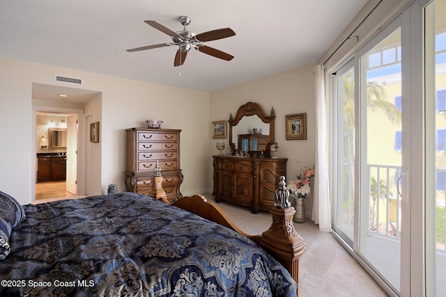 carpeted bedroom featuring connected bathroom, access to outside, and ceiling fan