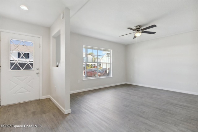 foyer featuring wood-type flooring and ceiling fan