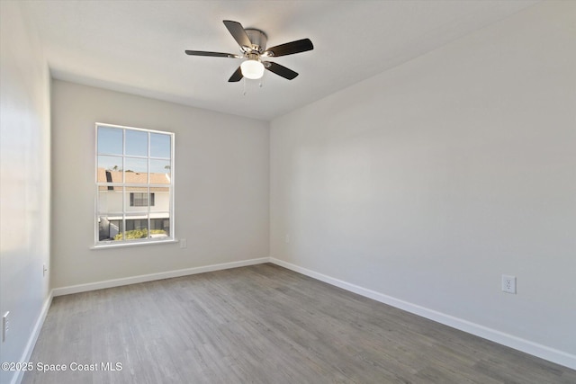 empty room featuring ceiling fan and hardwood / wood-style floors