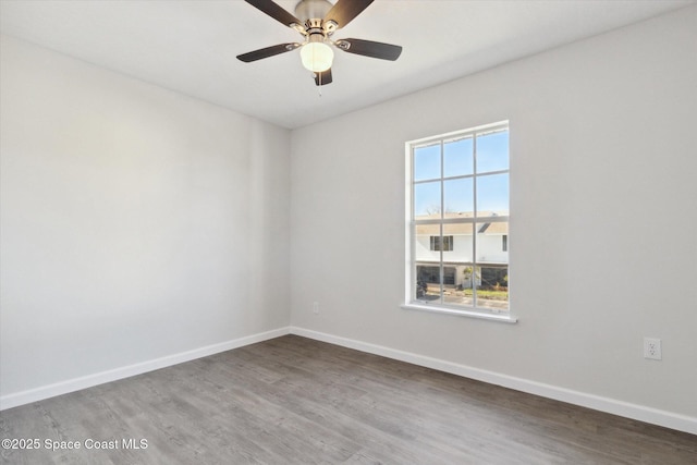 spare room with ceiling fan and hardwood / wood-style floors