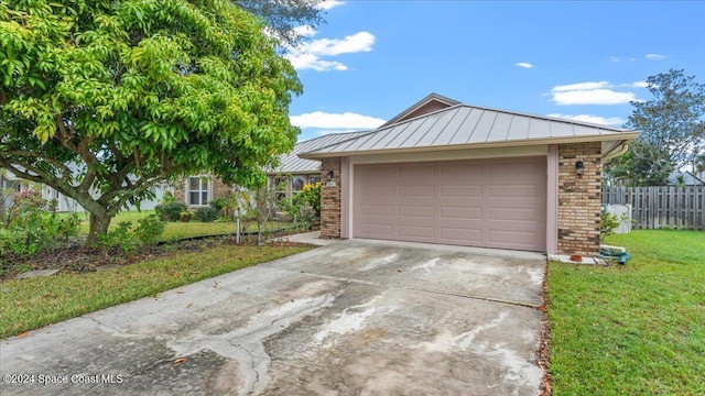 garage featuring a yard