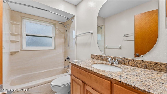 full bathroom with vanity, shower / bath combination, and toilet