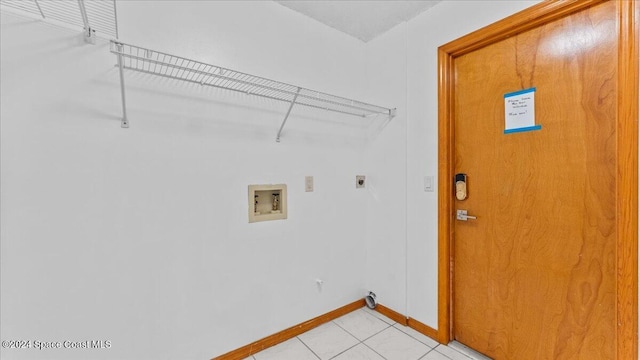 laundry area with washer hookup, electric dryer hookup, and light tile patterned flooring