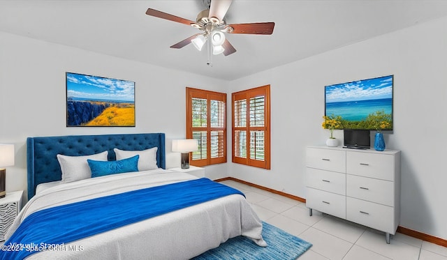 tiled bedroom featuring ceiling fan