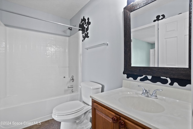 full bathroom featuring shower / bath combination, tile patterned floors, a textured ceiling, vanity, and toilet