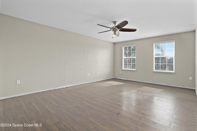 unfurnished room featuring hardwood / wood-style floors and ceiling fan