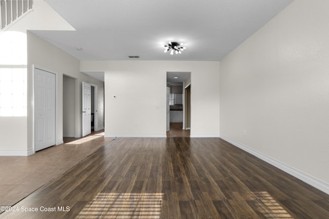 unfurnished room featuring dark hardwood / wood-style floors