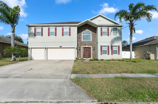 view of front of house featuring a garage and a front yard