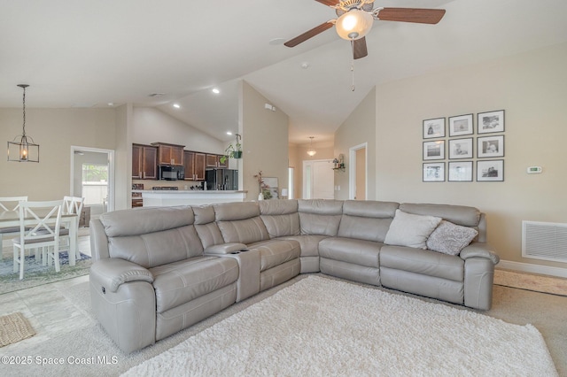 living area featuring a ceiling fan, baseboards, visible vents, high vaulted ceiling, and light carpet