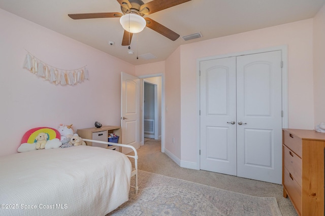 bedroom with visible vents, light carpet, a closet, and ceiling fan