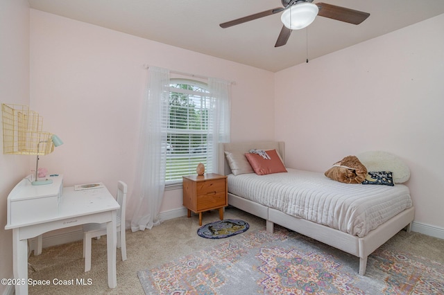 bedroom featuring ceiling fan, baseboards, and carpet