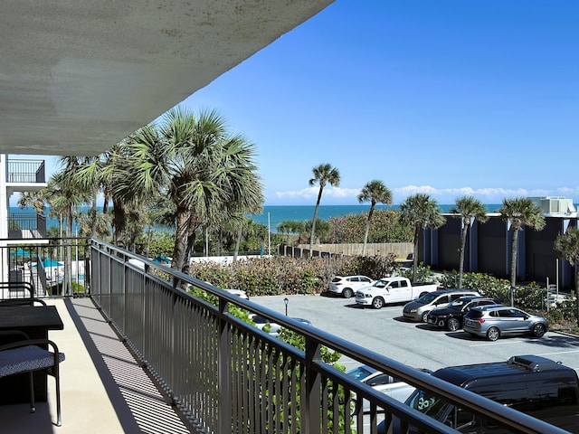 balcony featuring a water view