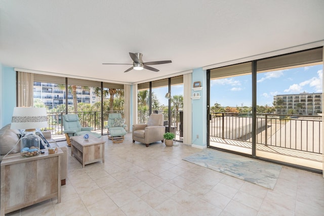 sunroom / solarium with a wealth of natural light and ceiling fan