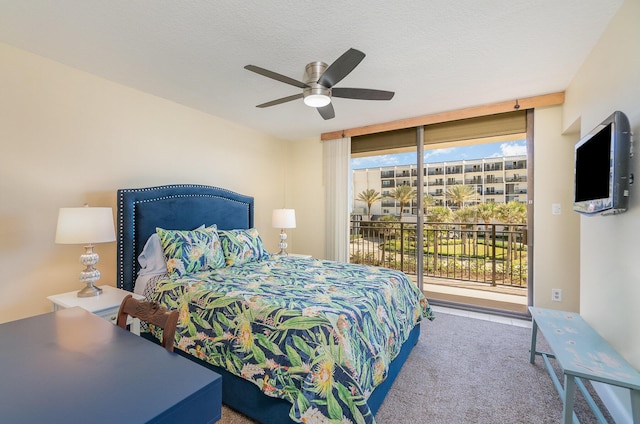 bedroom featuring access to exterior, multiple windows, carpet floors, and ceiling fan